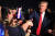 도널드 트럼프 미국 대통령이 지난 18일 플로리다주 마이애미 공항에서 지지자들을 만나 악수하고 있다. [AFP=연합뉴스]
