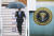 도널드 트럼프 미국 대통령이 28~29일 일본 오사카에서 열리는 G20 정상회의에 참석하기 위해 27일 장마 비가 내리는 간사이 공항에 도착해 우산을 쓰고 트랩에서 내리고 있다. [AP=연합뉴스].