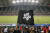 카타르 월드컵 홍콩과 이란의 경기 중 한 홍콩 축구팬이 검은색 홍콩 깃발을 흔들고 있다. [AP=연합뉴스]