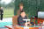 김여정 북한 노동당 제1부부장(왼쪽)이 지난 10일 마시일 발사 통제소 밖에서 손을 모은 채 서 있다. [노동신문=연합뉴스]