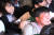 통합진보당이 지난 2012월 5월 12일 일산 킨텍스에서 개최한 중앙위원회에서 당권파 당원들이 단상에 난입해 조준호 공동대표에게 폭력을 행사하고 있다. [중앙포토]