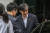 조국 법무부 장관이 27일 오전 서울 서초구 방배동 자택을 나서고 있다. [뉴스1]