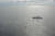 7일 동해 대화퇴 해상에서 일본 수산청 소속 구조선(오른쪽 큰 배)이 북한 측 어선(왼쪽 작은 배)에 있는 승조원을 구출하고 있다.[로이터=연합뉴스]