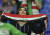 한 여성 축구팬이 지난 1월 16일 아랍에미레이트 두바이에서 열린 이란과 이라크의 AFC 남자축구 경기에서 이란 국기를 들고 응원하고 있다. [AP=연합뉴스]