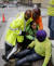 구조대의 도움을 받아 대피한 한 근로자 모습. [AP=연합뉴스]