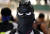 배트맨 마스크를 쓴 시위대. [로이터=연합뉴스] 