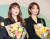29일 오전 서울 63컨벤션센터에서 열린 제4회 금융의 날 기념식에서 표창을 받은 배우 신민아(오른쪽), 가수 홍진영이 꽃다발을 들고 있다. [연합뉴스]