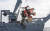 독도 인근 해상에서 추락한 소방헬기가 3일 오후 해군 청해진함에 의해 인양되고 있다. [사진 동해해경청]