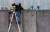 지난 달 30일(현지시간) 독일 바이마르에서 열린 베를린 장벽 붕괴 30주년 기념 공연에서 예술가들이 임시로 설치한 벽에 사다리를 설치하고 작가들의 동상이 있는 곳을 내다보고 있다. [AP=연합뉴스]