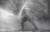 11일 산티아고에서 한 시민이 진압 경찰이 쏘는 물대포에 맞서고 있다. [ REUTERS=연합뉴스]