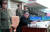 김정은 국무위원장이 원산갈마비행장에서 열린 &#39;조선인민군 항공 및 반항공군 비행지휘성원들의 전투비행술경기대회-2019&#39;를 참관하고 있다.[연합뉴스]