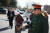 지난 2012년 탈북자 강제북송에 항의하는 미국 인권단체들이 주미 중국 대사관 앞에서 벌인 시위에서 중국 공안 복장을 한 한 참가자가 얼굴을 가린채 포박을 한 여성들을 끌고가고 있다. [연합뉴스]