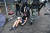 18일(현지시간) 이공대 인근에서 한 여성 시위대가 경찰들에게 끌려가고 있다. [AFP=연합뉴스]