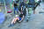 홍콩 경찰이 18일 이공대 주변의 시위현장에서 한 여성 시위대를 붙잡아 끌고 가고 있다. 경찰은 시위대의 마지막 보루인 이공대를 포위해 진압 작전에 들어갔다. [AFP=연합뉴스]
