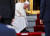 프란치스코 교황이 21일 왓 랏차보핏 불교사원에 들어가기 위해 신발을 벗고 있다. [로이터=연합뉴스]