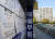 서울 강남구 은마아파트 내 상가에 위치한 한 부동산의 시세표가 붙은 유리창에 비친 아파트 모습. ［연합뉴스］ 