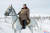 김정은 북한 국무위원장이 군 간부들과 함께 군마를 타고 백두산을 등정했다고 조선중앙통신이 4일 보도했다. 사진은 백마를 탄 김 위원장. [연합뉴스]