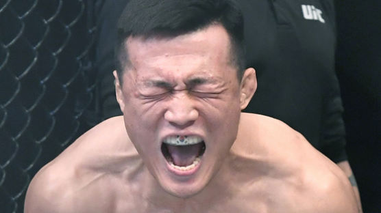 [서소문사진관] 태극기 마우스피스 낀 '코리안 좀비' 정찬성, UFC서 화끈한 1R TKO 승리