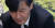 조국 전 법무부 장관이 지난해 9월 부산 기장군 부산추모공원에 안장된 고 김홍영 검사 묘비를 만져보고 있다. [연합뉴스]