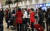 지난달 21일 유엔 안보리의 북한 해외 노동자 송환 시한을 하루 앞두고 중국 베이징 서우두 공항에서 북한 여성들이 입국장에서 감독관으로 보이는 사람의 인솔을 받고 있다.[연합뉴스]