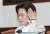 추미애 법무부 장관이 21일 서울 종로구 정부서울청사에서 열린 서울-세종 영상 국무회의에서 머리카락을 쓸어 넘기고 있다. [뉴스1]