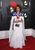 26일(현지시간) 팝가수 조이 빌라가 미국 성조기를 연상케 하는 흰색 드레스를 입고 레드카펫 행사에 참석해 있다. [EPA=연합뉴스]