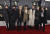 방탄소년단이 26일(현지시각) 미국 캘리포니아 로스앤젤레스 스테이플스 센터에서 열린 ‘제 62회 그래미 어워드’ 레드카펫 행사에 참석해 기념사진을 찍고 있다. [AP=연합뉴스]