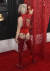 리키 리벨은 엉덩이에 적힌 탄핵 메시지가 훤히 보이는 붉은색 의상을 입고 레드카펫에 참석했다. [AP=연합뉴스]
