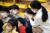 지난달 30일 광주 북구청 직장어린이집에서 보건소 직원이 원아에게 감염병 예방을 위한 마스크 착용법을 안내하고 있다. [연합뉴스]