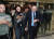 정봉주 전 의원이 11일 국회에서 열린 입장발표 기자회견에 참석하기 위해 이동하며 시간을 확인하고 있다. [연합뉴스]
