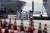 11일 일본 요코하마항에 정박중인 '다이아몬드 프린세스'호 앞에 보호복을 입은 의료진들이 이동하고 있다. [AP=연합뉴스]