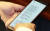 19일 국회 본회의장에서 민주당 한 의원이 오제세 의원에게서 받은 문자를 읽고 있다. [스카이데일리 제공]