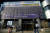 로이터통신이 22일 보도한 한국의 대구 신천지 교회의 모습. 마스크를 쓴 시민이 신천지예수교회 앞을 지나고 있다. [로이터=연합뉴스]