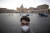지난 11일 신종 코로나로 인해 관광객의 발길이 끊긴 이탈리아 로마의 성베드로 성당 앞을 마스크를 쓴 한 시민이 지나가고 있다. [EPA=연합뉴스]