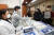 6일 오후 경기도 수원시 경기대학교 건강증진센터에서 외국인 유학생들이 마스크를 받고 있다.[연합뉴스]