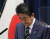 23일 일본 참의원에 출석한 아베 신조 일본 총리. 그는 이날 '올림픽 연기' 검토를 용인하겠다는 뜻을 밝혔다. [EPA=연합뉴스]  