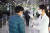 30일 오전 9시 서울 서초구 태봉로 KT연구개발센터에서 열린 정기 주주총회에 입장하기 위해 한 주주가 온도 체크를 받고 있다. [사진 KT]