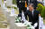 문재인 대통령이 19일 서울 강북구 국립4.19민주묘지에서 열린 제60주년 4.19혁명 기념식에 참석한 뒤 故 전한승 군 묘비를 어루만지고 있다. 청와대 사진기자단
