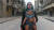 시리아 내전을 기록한 다큐멘터리 '사마에게'의 포스터 사진. .파괴된 동알레포의 모습을 배경으로 전쟁터에서 낳아 기른 딸 사마를 와드 알카텝 감독이 안고 있다. [사진 엣나인 필름 제공]