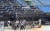 프로야구 무관중 개막을 하루 앞둔 4일 오전 잠실야구장에서 두산 선수들이 훈련하고 있다. 관중석에서는 관계자들이 물청소를 하고 있다. [연합뉴스]