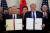 지난 1월 15일 미국 백악관에서 도널드 트럼프 미국 대통령(오른쪽)과 류허 중국 부총리가 미중 1단계 무역합의에 서명한 뒤 서류를 들어보이고 있다.[로이터=연합뉴스]