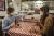 이탈리아 로마의 한 레스토랑 테이블에 투명 가림막이 설치돼 있다. 두 남녀가 이 가림막을 사이에 두고 앉아 와인을 마시고 있다. [EPA=연합뉴스]