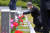 노태우 전 대통령 아들 노재헌씨가 29일 광주 북구 운정동 국립5·18민주묘지에서 헌화·분향을 한 뒤 묘역 앞에 무릎 꿇고 묘비를 어루만지고 있다. 뉴스1