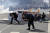 31일(현지시간) 미 캘리포니아주 로스앤젤레스 인근에서 벌어진 시위에서 경찰이 쏜 최루탄을 시위대가 피하고 있다. [AP=연합뉴스]
