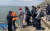 충남 서해안의 포구에서 승객들이 발열체크를 한 뒤 마스크를 착용하고 배에 오르고 있다. [사진 보령해경]
