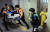 지난 1일 오후 7시25분쯤 A군이 병원으로 옮겨지는 모습. 오른쪽 노란 옷이 계모 B씨. 연합뉴스 
