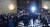제21대 국회 첫 상임위원장 선출을 위한 본회의가 열린 15일 항의 구호를 외치는 미래통합당 의원들 사이로 더불어민주당 의원들이 본회의장에 입장하고 있다. [연합뉴스]