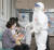 신종 코로나바이러스 감염증(코로나19) 확진자가 도봉구 성심데이케어센터에서 발생한 가운데 12일 서울 도봉구보건소에서 시민들이 검체 검사를 받기 위해 기다리고 있다. 뉴스1