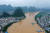 지난 8일 중국 남부 광시좍종자치구의 강이 일주일째 이어진 폭우로 마을이 물에 잠긴 모습. [신화통신=연합뉴스]