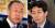 반기문 국가기후환경회의 위원장(왼쪽)과 윤건영 더불어민당 의원. 연합뉴스·뉴스1
